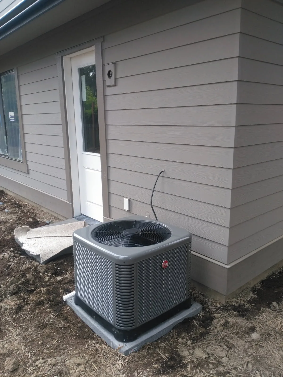 Rheem outdoor unit on a new-construction home site